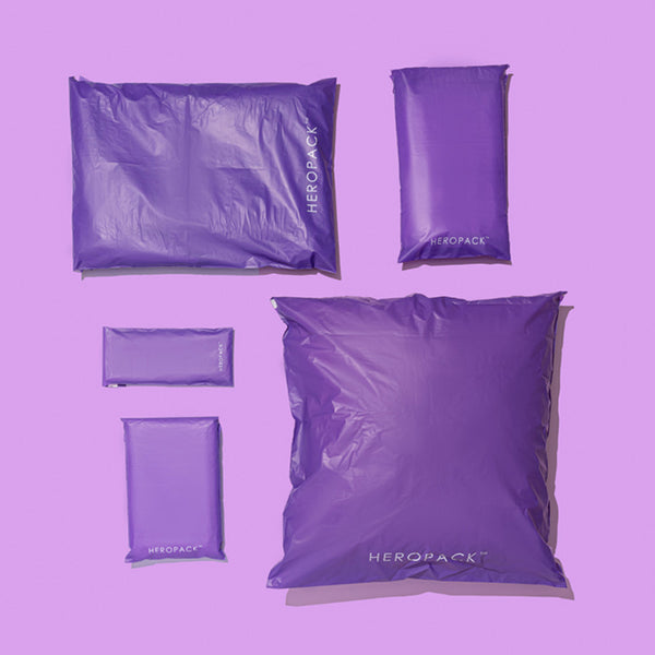 Purple HEROPACK compostable mailers in different sizes